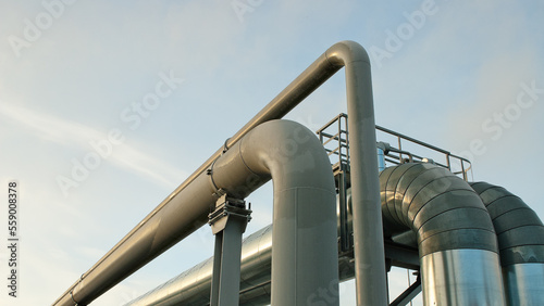 pipeline close-up, in the photo pipeline blue sky and clouds, bottom view