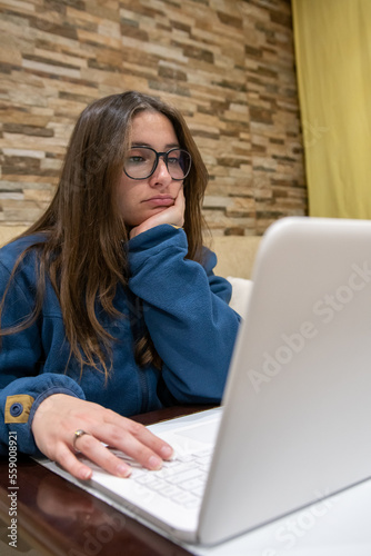 Bored girl working with computer