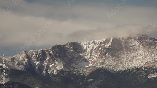 Slow pan of snow covered mountain Pike's Peak Colorado photo