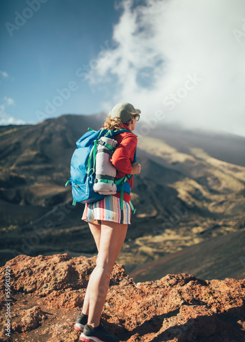 Hiker standing on slopes of Mt. Etna 