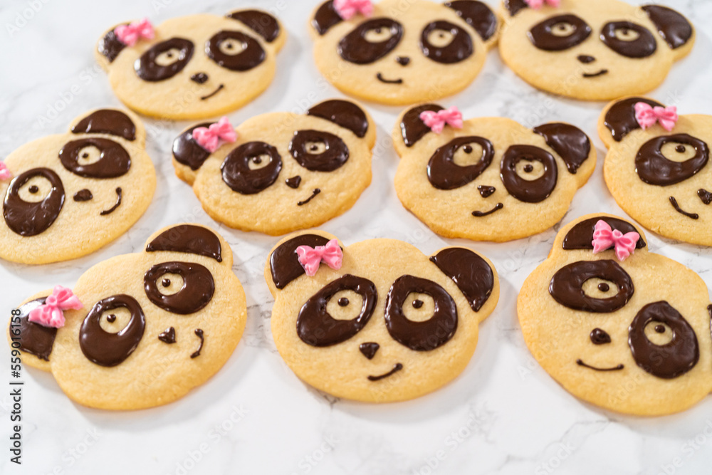 Panda shaped shortbread cookies with chocolate icing