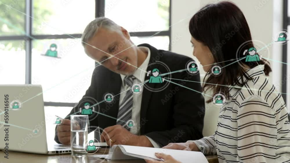 Animation of network of connections over diverse business people in office Animation of network of connections over diverse business people in office