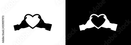 Hands hold a bright heart. Icon on a white and black background.