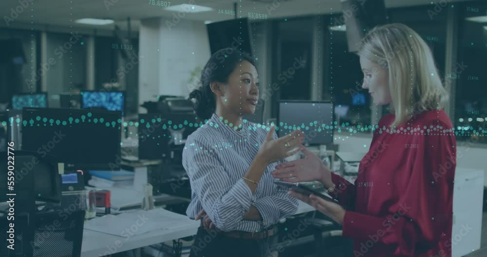 Animation of financial data processing over diverse businesswomen Animation of financial data processing over diverse businesswomen