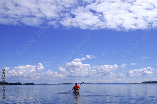 Kayaking round the tip of Marsh Island, Muscongus Bay, Maine, USA photo