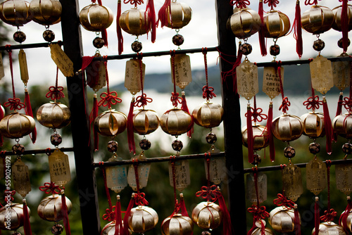 Bells and plates inscribed blessings and wishes line a path to Sun Moon Lake in West Central Taiwan, October 21, 2010. photo