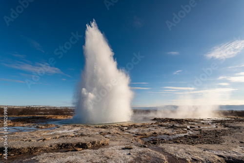 Beautiful eruption of the Strokkur geyser, less know but more active than the more famous Great Geysir, Haukadalur valley, Golden Circle Route, Iceland