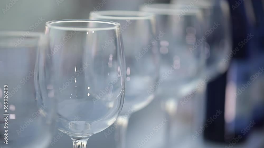 Empty wine glasses on the background of a summer party outdoor restaurant Empty wine glasses on the background of a summer party outdoor restaurant