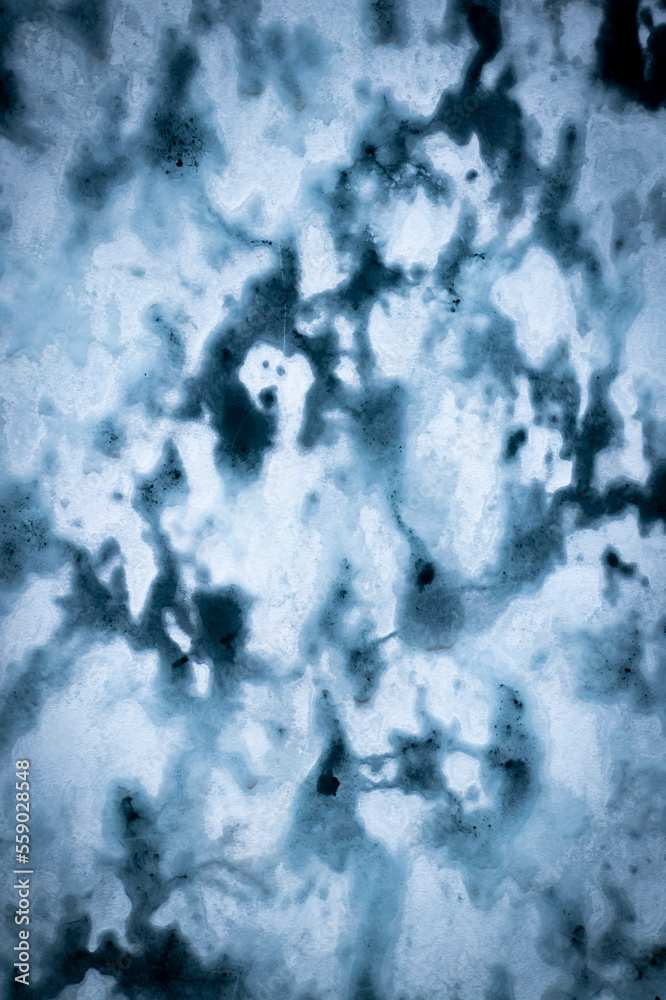 Melting ice in a lake of Hardangervidda in Norway from above
