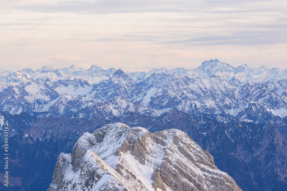 The peaks stand out in the last minutes of the day before the sun sets on a beautiful evening over the Swiss Alps.