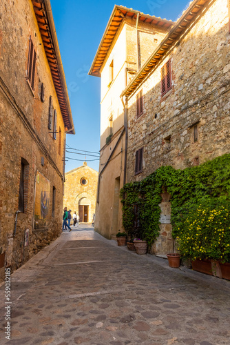 Fototapeta Naklejka Na Ścianę i Meble -  Monteriggioni,  Italy, 17 April 2022: historic center of the medieval town at sunset