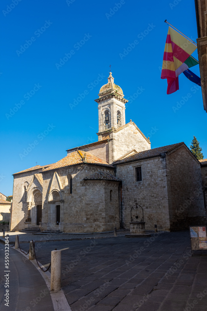 Fototapeta premium San Quirico d'Orcia, Italy, 16 April 2022: Medieval church of the historic center