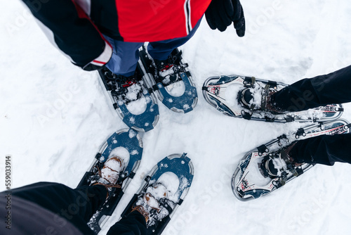 person going for a hike with snowshoes in winter