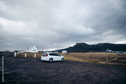 road trip with a white car in the mountain