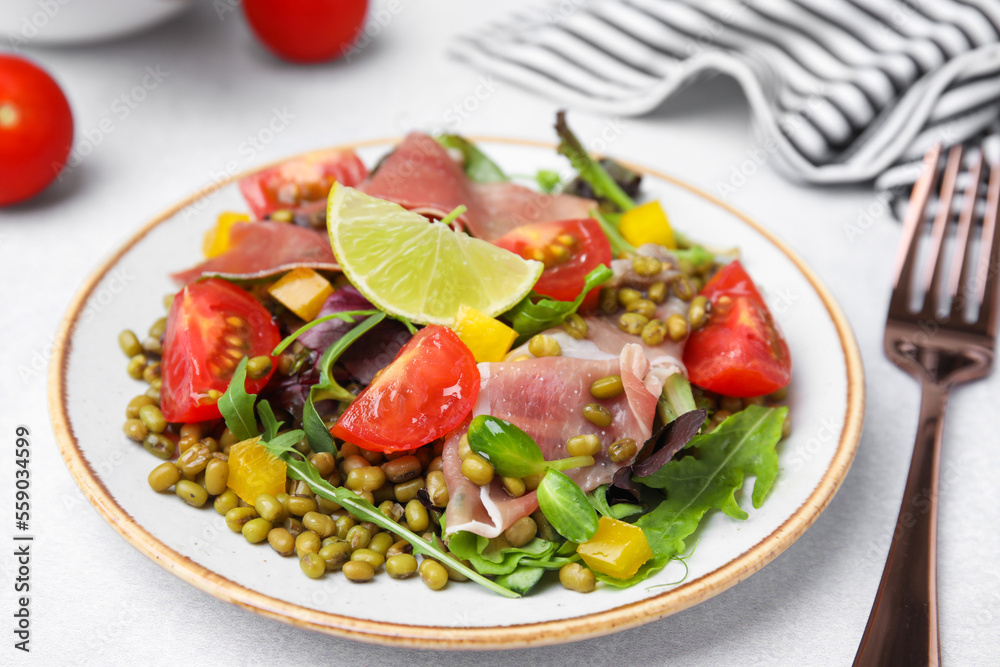 Plate of salad with mung beans on white table, closeup Plate of salad with mung beans on white table, closeup