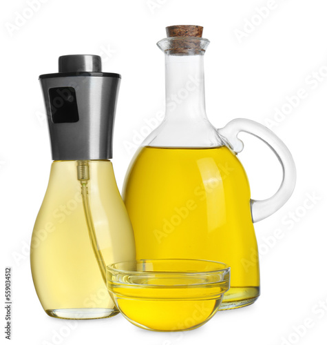 Bottles and bowl of cooking oil on white background
