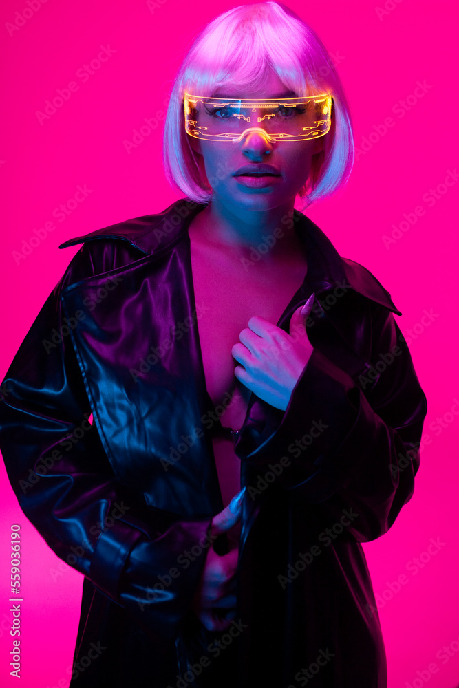 A girl in the cyberpunk style. Girl in neon with luminous glasses A girl in the cyberpunk style. Girl in neon with luminous glasses