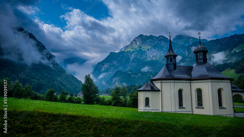 Beautiful chapel in a small village in the Swiss Alps - travel photography