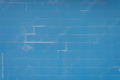 An abstract image of the texture on a blue brick exterior wall.