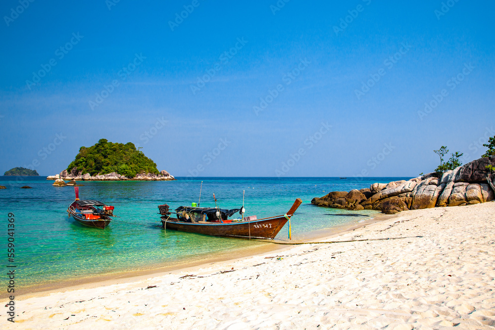 Sunrise beach with long tail boats in Koh Lipe, Satun, Thailand