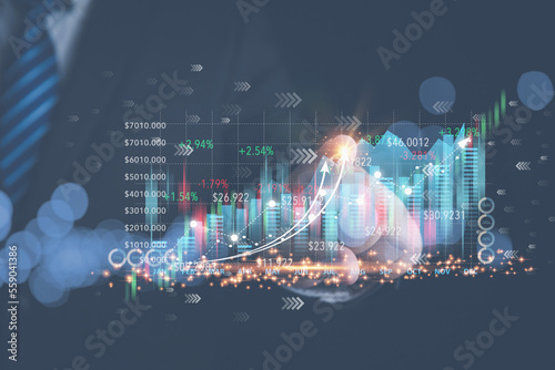 Businessman touching virtual screen on growth graph stock chart. Virtual screen with growth graph, stock chart. Investment, business, technology concept.