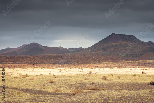 Wild volcanic landscape of Los Volcanes Natural Park in Lanzarote, Canary Islands, Spain