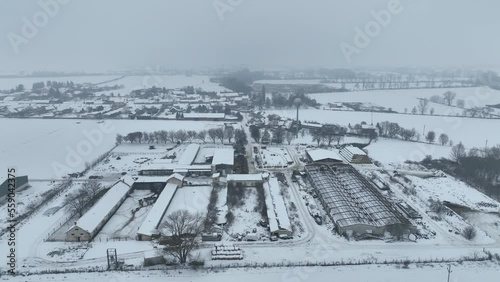 Cowshed warehouse farm barn winter frost snow drone aerial building agricultural breeding cattle pigs, breeding goats, sheep horses. Village snowy ice Stetovice farming farmer stock snowfall. Europe photo