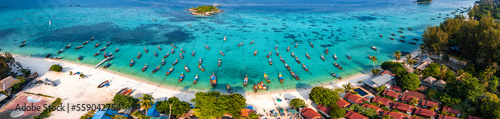 Aerial view of Sunrise beach with long tail boats in Koh Lipe, Satun, Thailand photo