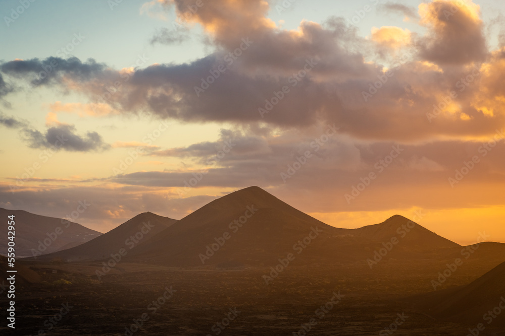 Beautiful silhouette of Lanzarote volcanos at sunset, Canary Islands,  Spain