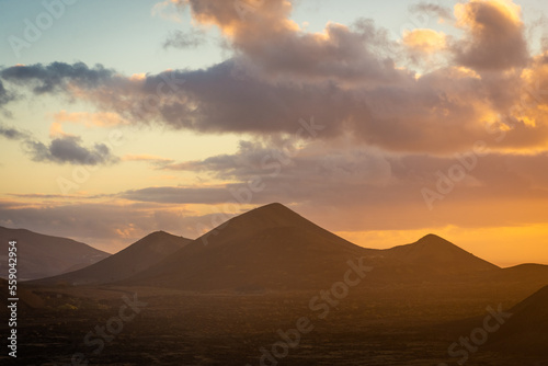 Beautiful silhouette of Lanzarote volcanos at sunset  Canary Islands   Spain