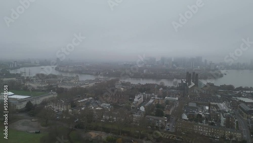 Aerial drone shot of historic residential buildings and London riverside.