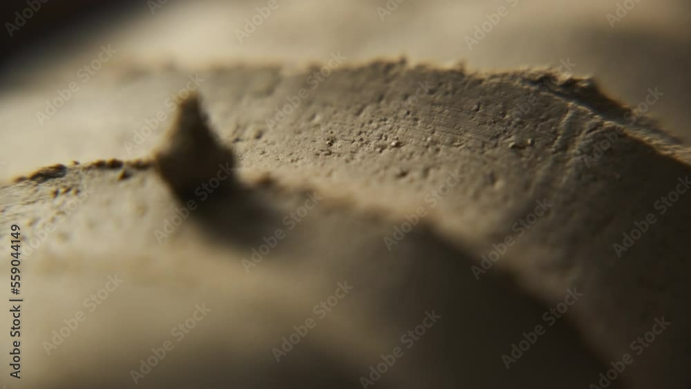 a potter makes a clay teapot in his workshop in a seashell video. a potter working with clay. a potter makes a unique clay teapot using authentic tools. women's, men's hands work with clay. a potter makes a clay teapot in his workshop in a seashell video. a potter working with clay. a potter makes a unique clay teapot using authentic tools. women's, men's hands work with clay.