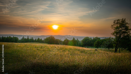 Beautiful sunset over farmlands in the Swiss Alps - travel photography