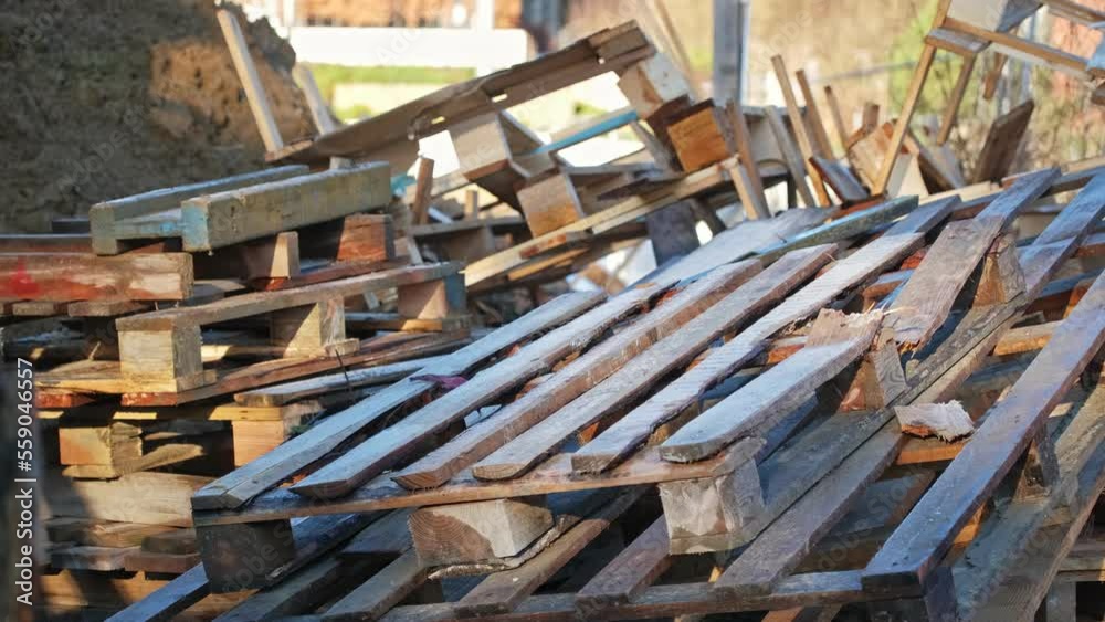 Messy Heap of Standardized Wooden Shipping Pallets Stored Outdoors Messy Heap of Standardized Wooden Shipping Pallets Stored Outdoors