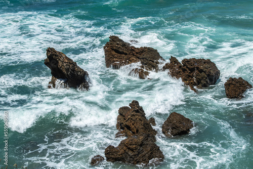 Fototapeta Naklejka Na Ścianę i Meble -  Rocks waves and the blue sea