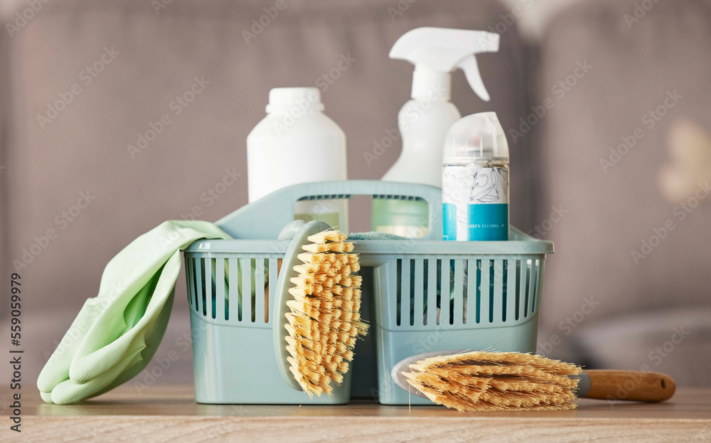 Φωτογραφία Product, basket and cleaning with a brush, supplies or detergent on a wooden table surface for housework