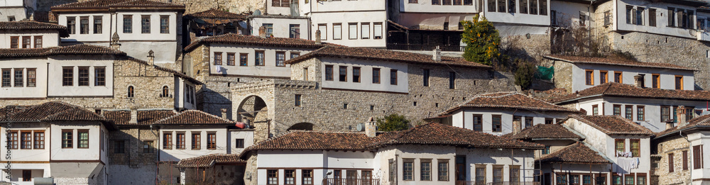 Traditional houses In Berat, Albania, Europe. Cityscape with those famous aligned white facades. Blue sky