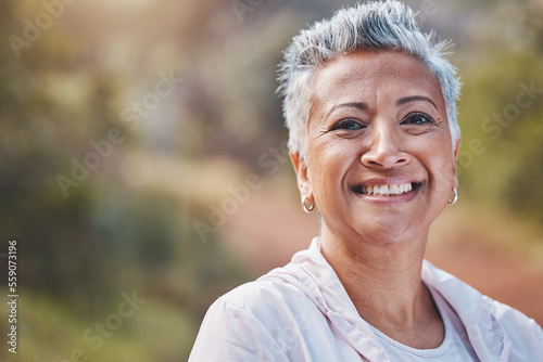 Fitness, face portrait and senior woman in nature ready for workout, exercise or training. Sports, park and retired elderly female from India preparing for running or jog for health and wellness.
