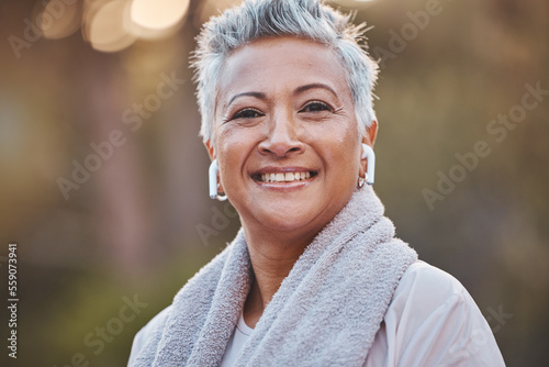 Fitness, nature and portrait of a old woman with music while outdoor for exercise in nature with earphones. Face of elderly female in a forest for a cardio workout for a healthy lifestyle and energy