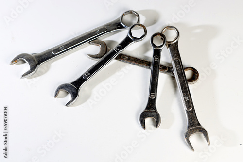 several modern wrenches on a white background