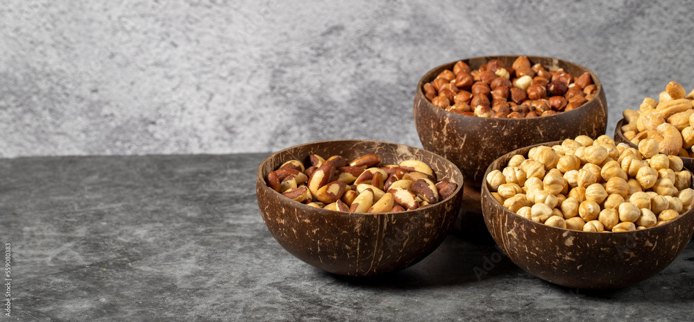 Hazelnuts, cashews and brazil nuts in bowl. Nuts varieties. Empty space for text. copy space