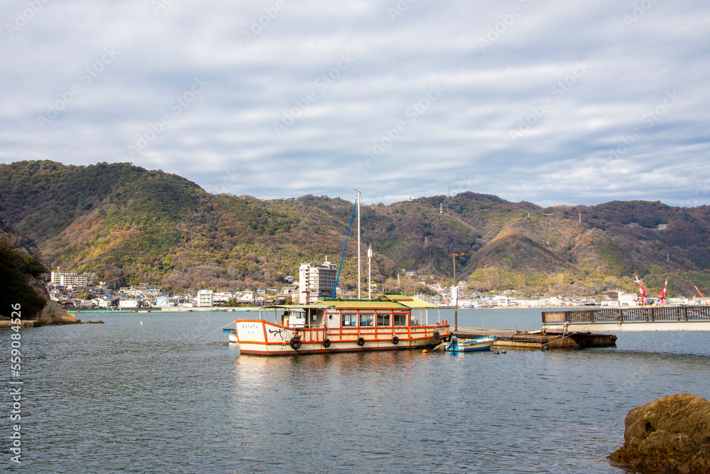 Fukuyama Japan 5th Dec 2022: The  ferry and ferry pier of Sensui Island. A small island in the Seto Inland Sea, The background is the city Tomonoura. 