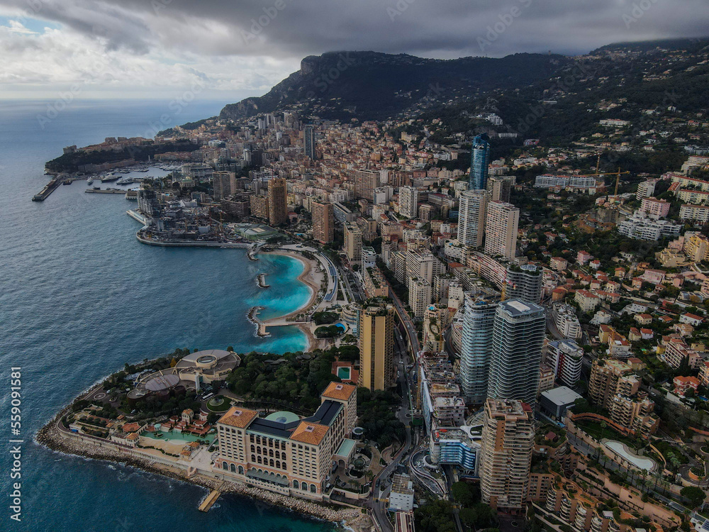 Aerial panoramic view of Monte Carlo. Monaco is a country on the French Riviera in Europe. Drone view of the famous city on the Mediterranean Sea, Monte Carlo casino in the city center, Marina Port.