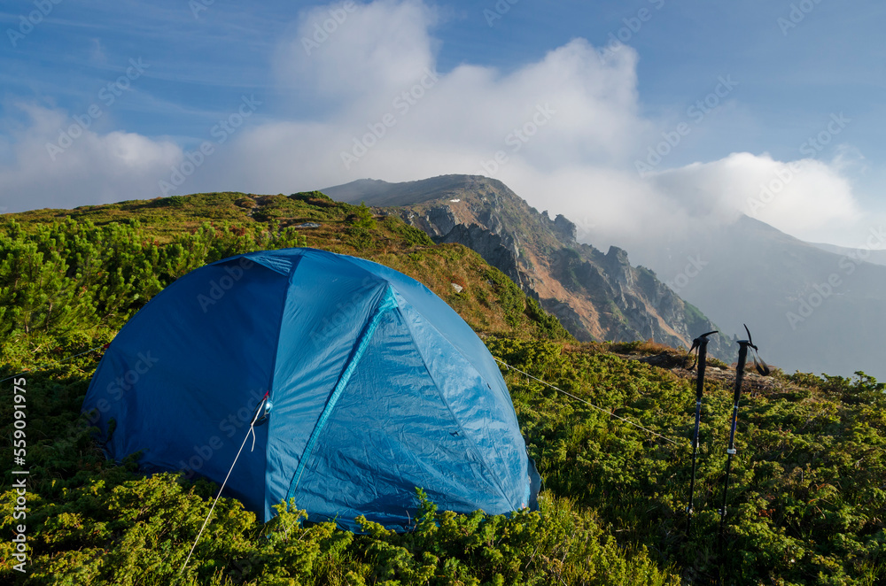 Hiking tent on the mountain top.