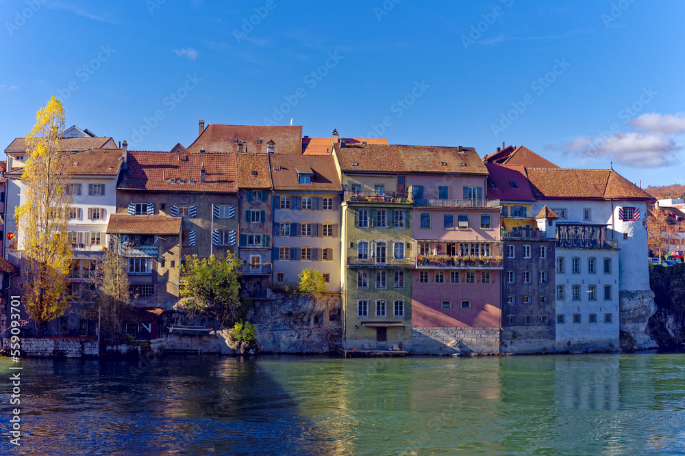 Medieval skyline of the old town of City of Olten, Canton Bern, with Aare River and wooden covered bridge on a sunny autumn day. Photo taken November 10th, 2022, Olten, Switzerland.