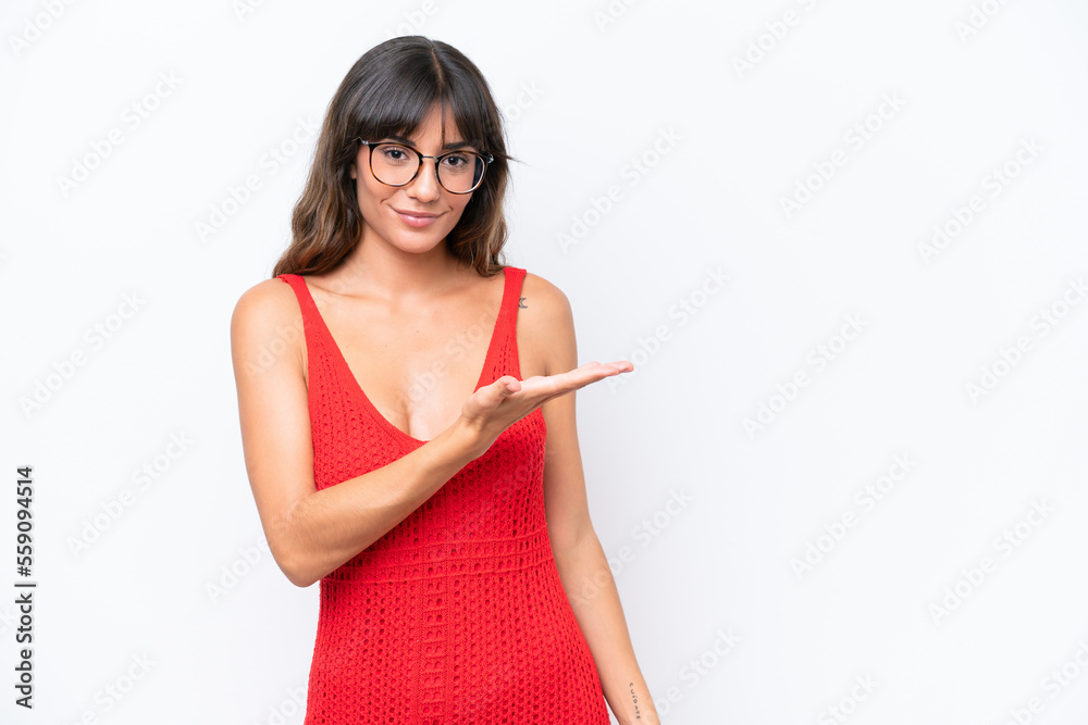 Young caucasian woman isolated on white background presenting an idea while looking smiling towards Young caucasian woman isolated on white background presenting an idea while looking smiling towards