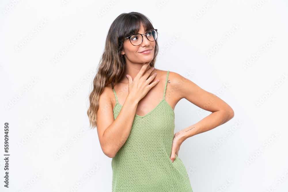 Young caucasian woman isolated on white background looking up while smiling Young caucasian woman isolated on white background looking up while smiling
