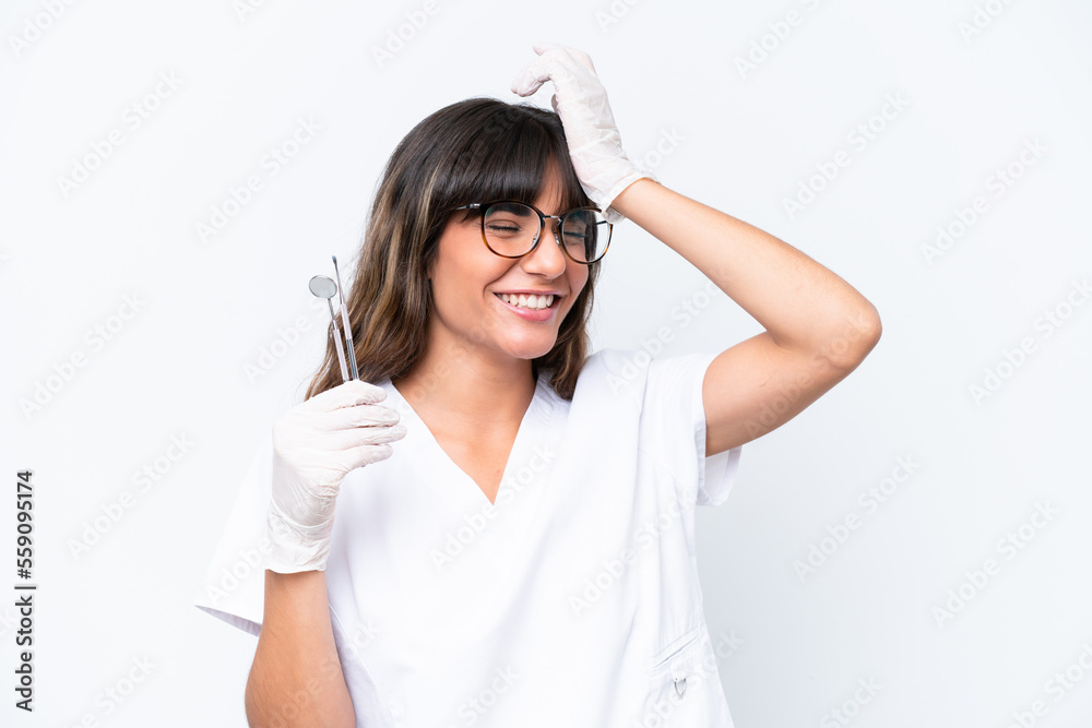 Dentist caucasian woman holding tools isolated on white background has realized something and intending the solution Dentist caucasian woman holding tools isolated on white background has realized something and intending the solution