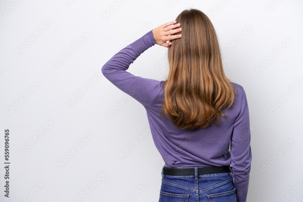 Young caucasian woman isolated on white background in back position and thinking Young caucasian woman isolated on white background in back position and thinking