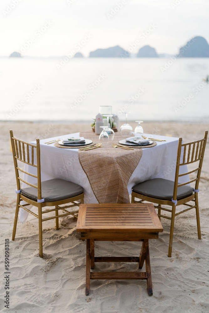 table and chairs on the beach